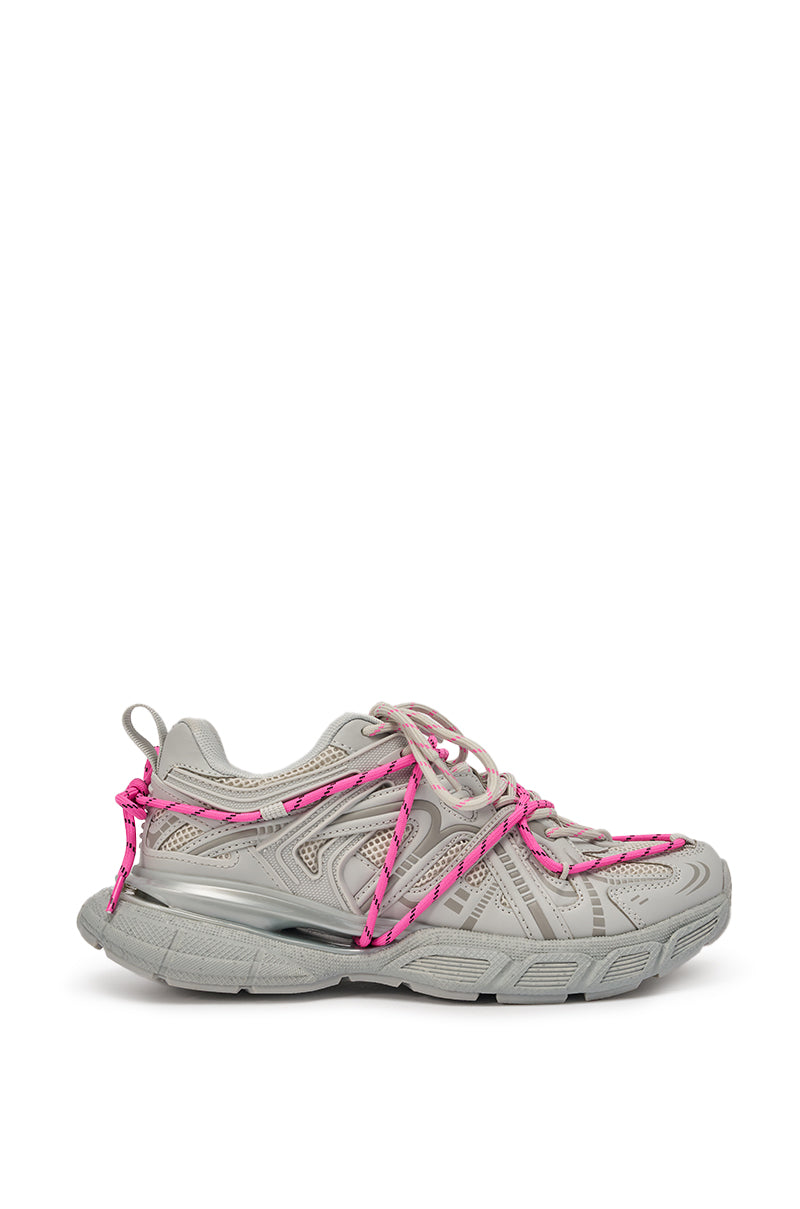 The AZALEA WANG SATINE GREY LACE UP SNEAKER features a light gray design, chunky sole, and pink cord detailing wrapped around the upper, shown against a white background. 5