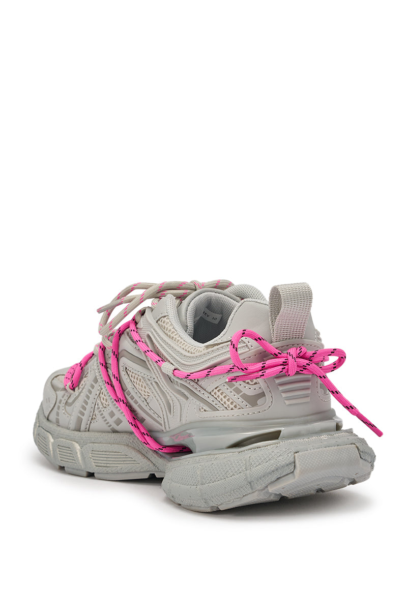 The AZALEA WANG SATINE GREY LACE UP SNEAKER features a chunky light gray platform, textured details, and bright pink laces, shown from the back at an angle on a white background. 7
