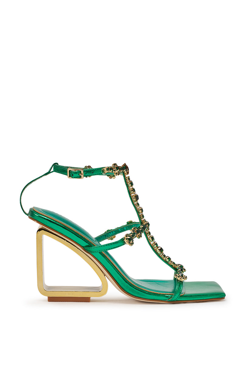 The AZALEA WANG SCHANTELLE GREEN EMBELLISHED UPPER WEDGE SANDAL features green rhinestones, a geometric gold wedge heel, T-strap design, and buckle ankle strap, shown on a white background. 2