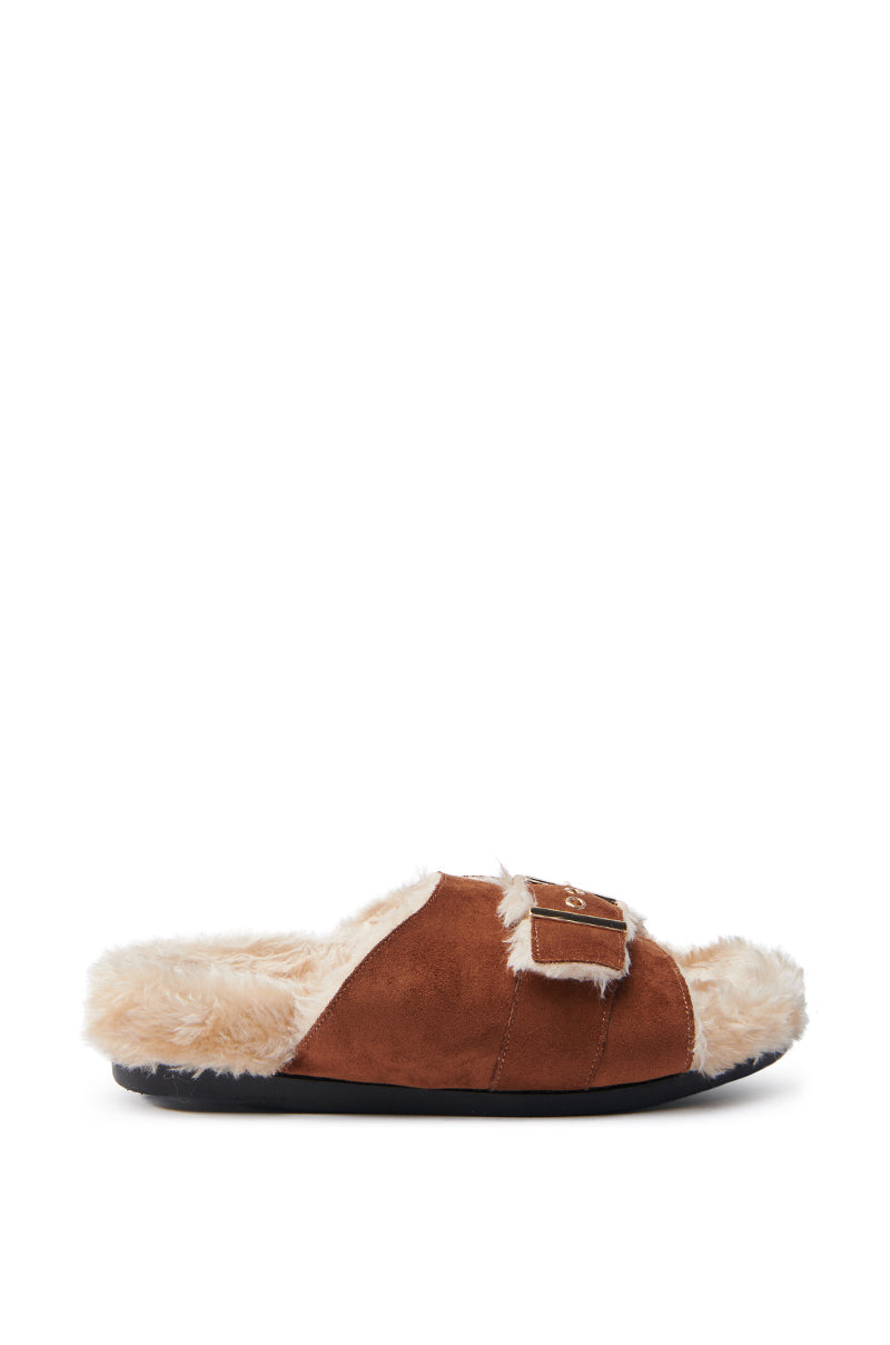 The AZALEA WANG SEANNA TAN FUR SANDAL is a brown slip-on slipper featuring a cozy faux suede upper, fluffy cream faux fur insole, open almond toe design, single adjustable strap on the upper side, and a black sole for a casual aesthetic.