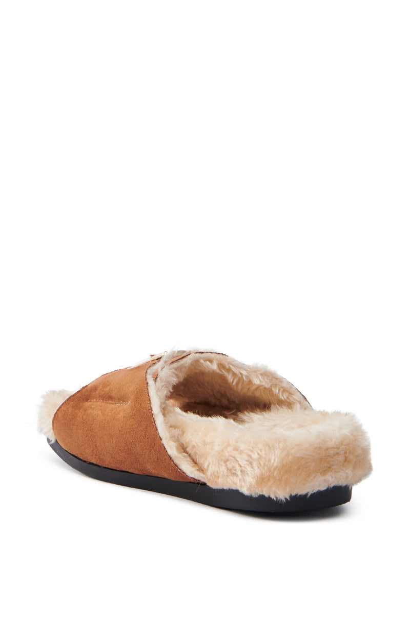 The AZALEA WANG SEANNA TAN FUR SANDAL is a brown faux suede slipper with an open almond toe, black sole, and cream-colored faux fur insole extending to the back. It's angled to beautifully display both the side and rear views.