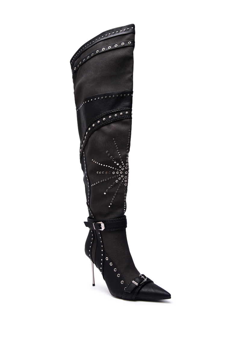 The AZALEA WANG SEASON BLACK MULTI EMBELLISHED STILETO BOOT is a black, knee-high boot featuring silver studs, decorative buckles, a pointed toe, stiletto heel, and a starburst stud pattern on the side.