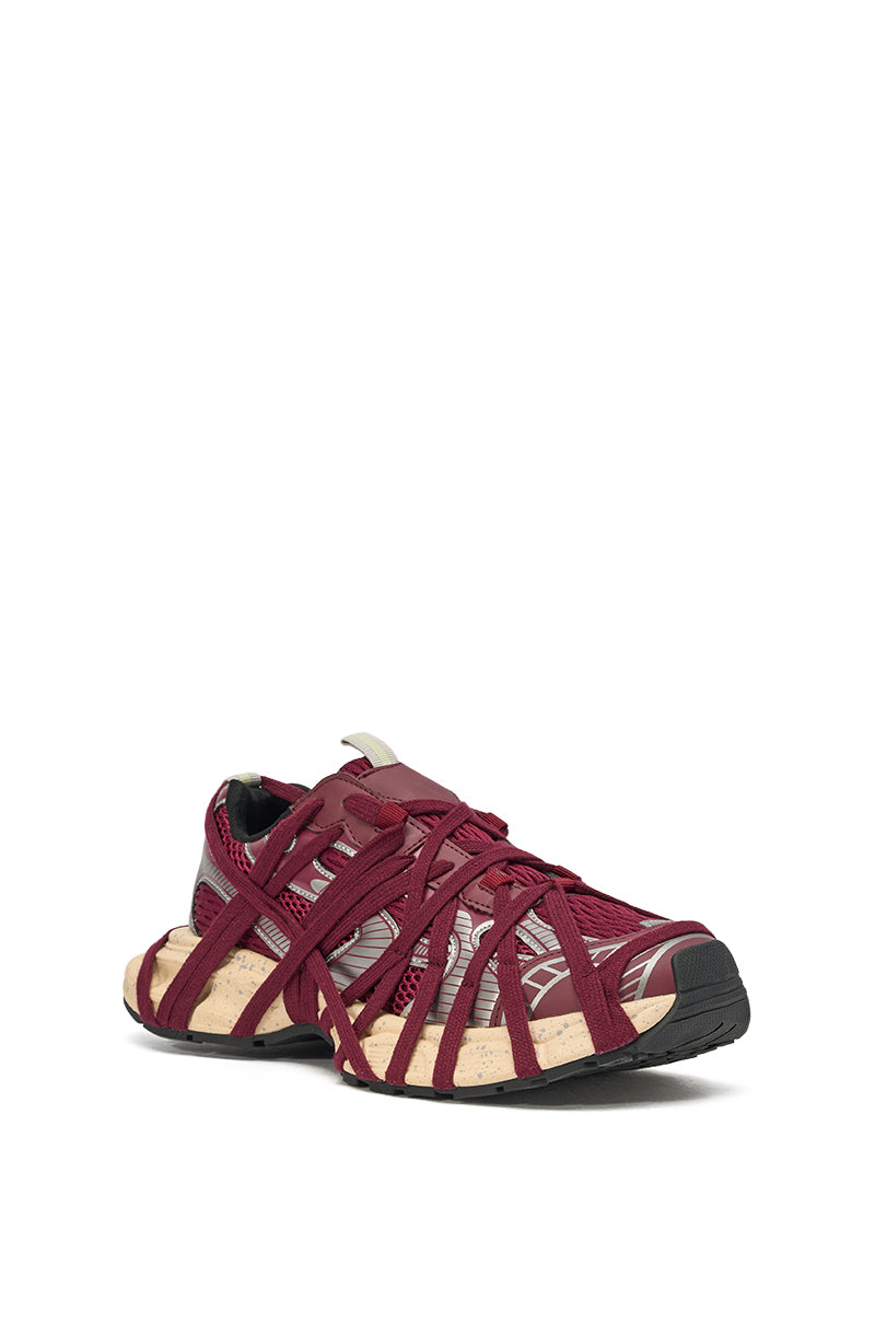 The AZALEA WANG SELIE BURGUNDY LACE UP SNEAKER features a chunky maroon and beige design with black accents, sporty web-like overlays, lace details, and a rugged sole—ideal for versatile sporty casual wear. Shown on a white background. 3