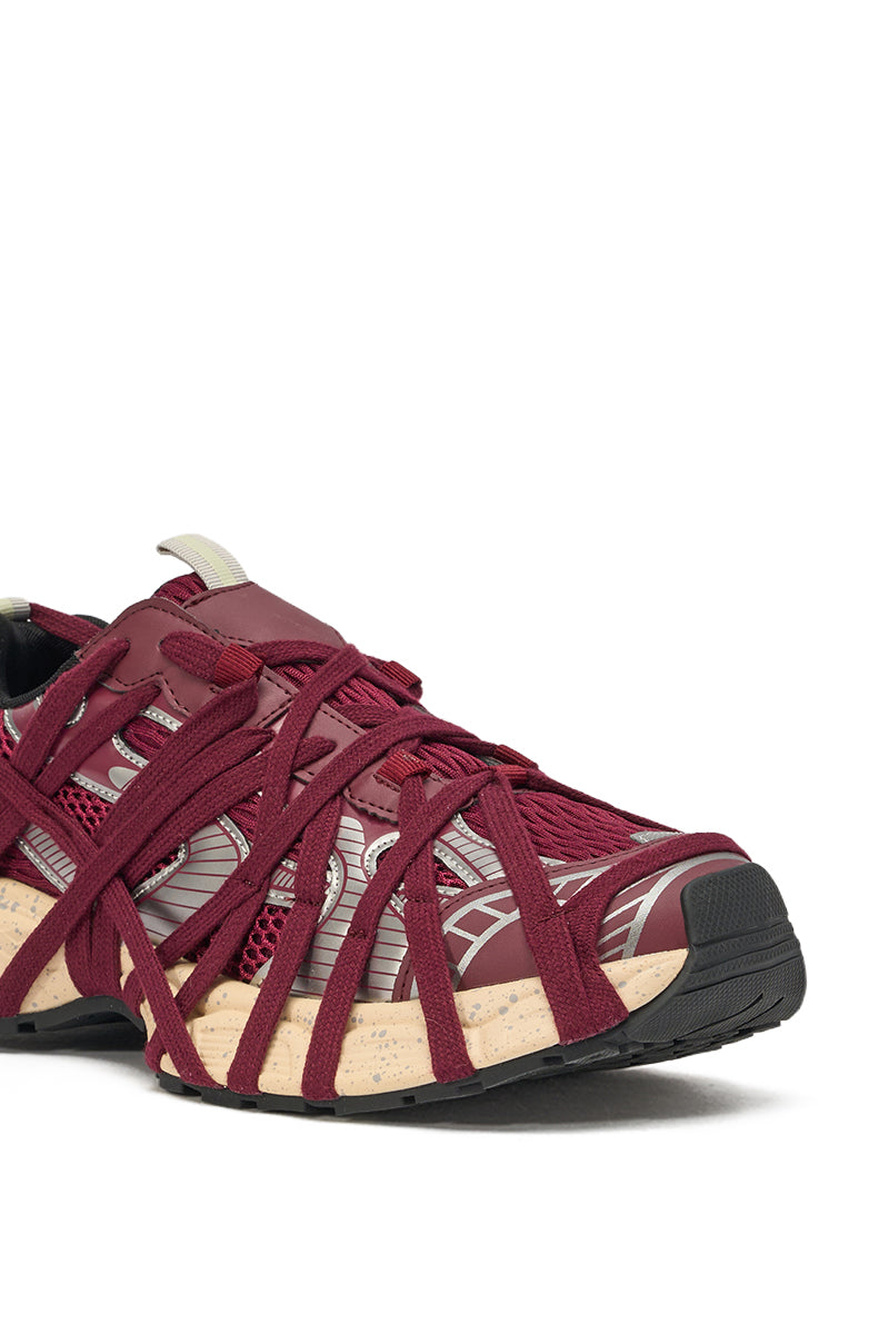 The AZALEA WANG SELIE BURGUNDY LACE UP SNEAKER showcases sporty styling with maroon crisscross straps over a mesh-like upper in maroon and beige, set on a thick, chunky sole. 5
