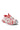 The AZALEA WANG SELIE RED FLAT SNEAKER is an athletic shoe featuring a distinctive white strap design that wraps around its red and white color scheme. It showcases a mesh pattern with a red pull tab at the heel, complemented by a platform sole. The laces are integrated with the straps for a unique look, enhancing its textile upper.