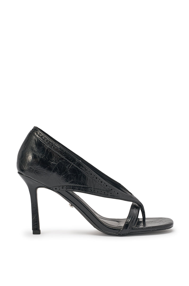 The AKIRA GOLD SELVARE BLACK THONG STILETTO SANDAL features black faux leather with a glossy, textured finish, an open square toe, and a slim front strap, shown against a white background. 3