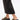 A person in black wide-leg pants stands on a white surface, wearing the AZALEA WANG SERGO BLACK EMBELLISHED CHUNKY SANDAL with a faux leather platform sole.