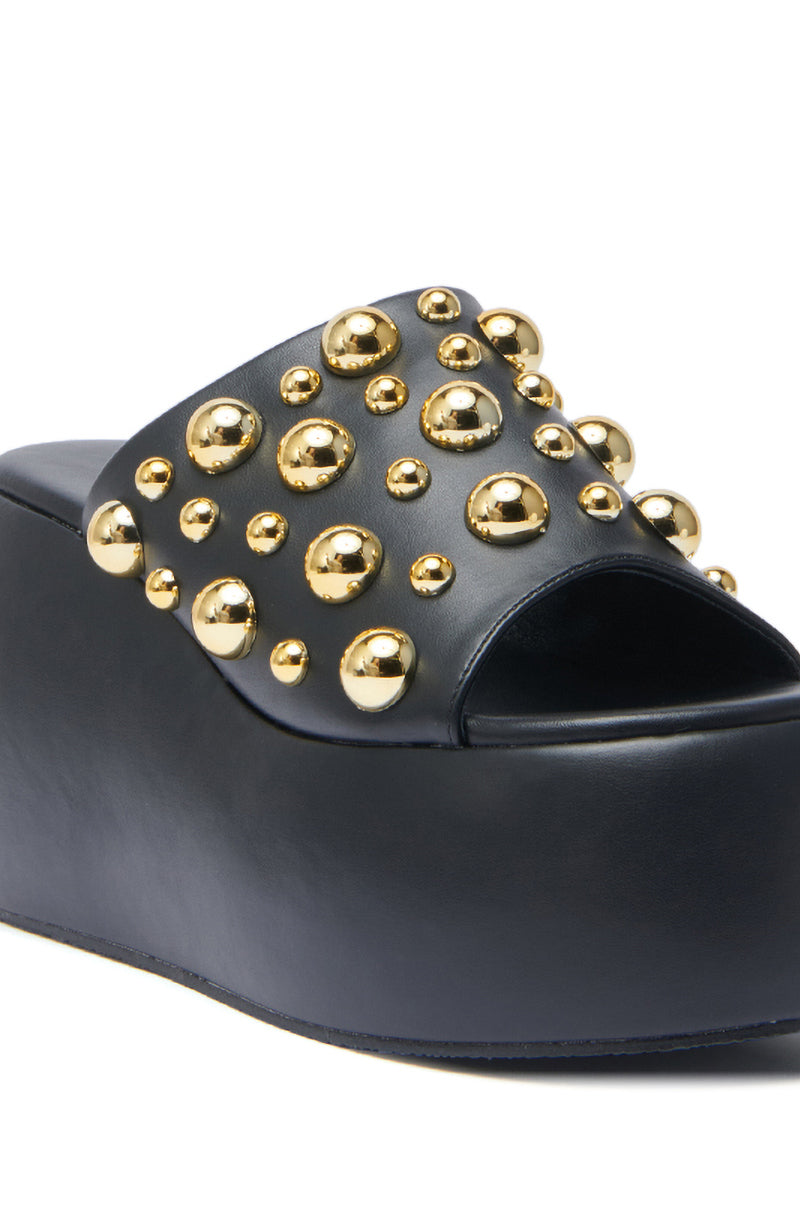 The AZALEA WANG SERGO Black Embellished Chunky Sandal features a wide faux leather strap with shiny gold studs and sits on a trendy platform sole.