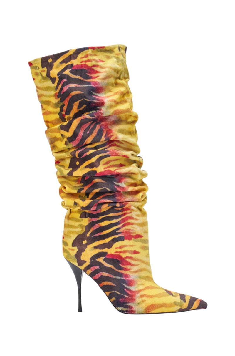 The AZALEA WANG SERIOUSLY TIGER SLOUCHY STILETTO BOOT is a knee-high, pointed-toe faux suede boot with a ruched shaft and a bold yellow, orange, and black tiger stripe print. 3