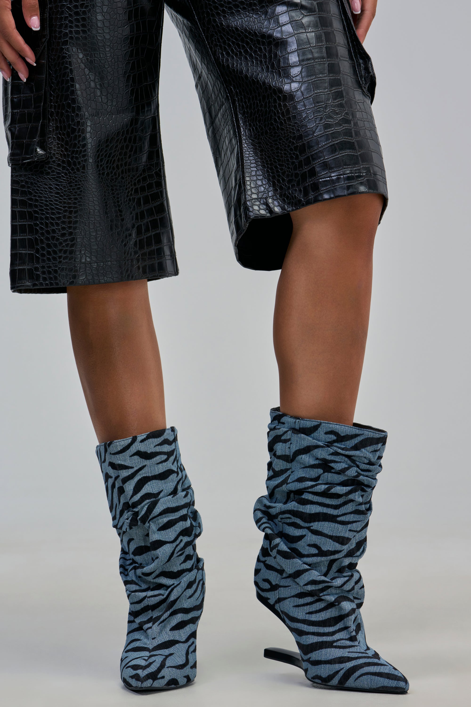 AZALEA WANG SERONA DENIM ZEBRA WEDGE BOOTIE in slouchy blue and black zebra-print denim.