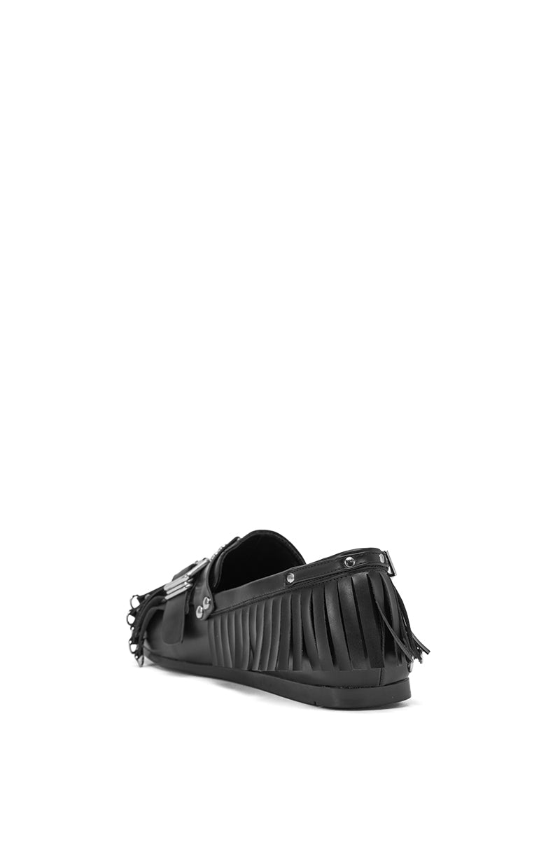 AZALEA WANG SEVYN black flat loafer with silver hardware, almond toe, and decorative fringe, displayed from a rear side angle on a plain white background. 5