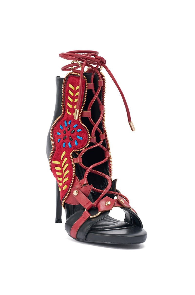 The AZALEA WANG SHAINIA BLACK MULTI SUEDE STILETTO SANDAL features a black suede design with red lace-up details, yellow and blue embroidery, gold accents, embroidered heels, and a comfort cushion insole for style and ease. 3
