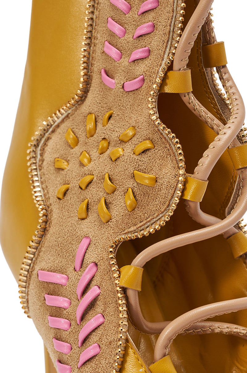Close-up of the AZALEA WANG SHAINIA MUSTARD MULTI STILETTO SANDAL, featuring mustard yellow, tan suede and pink leather details, decorative stitching, beige laces, raised patterns, and gold beaded trim. 15