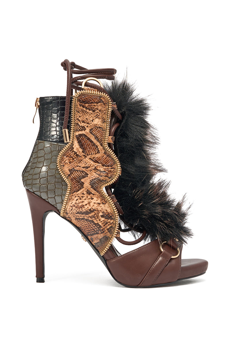 The AZALEA WANG SHAINY SNAKE BROWN MULTI is a lace-up stiletto sandal with brown snakeskin-textured leather, black faux fur accents, a gold zipper, open toe, and bold faux leather heels. 2