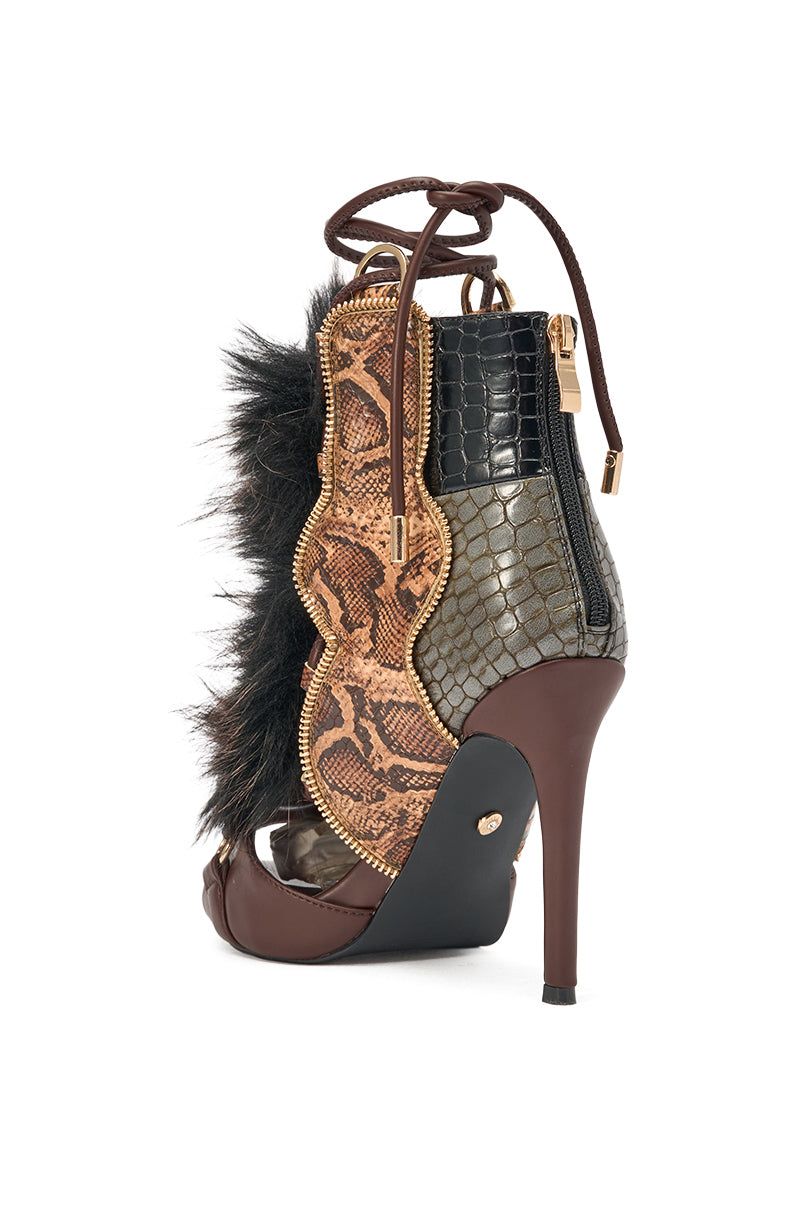 The AZALEA WANG SHAINY SNAKE BROWN MULTI is an ankle-high stiletto sandal with faux snakeskin, crocodile pattern, dark fur, brown leather, gold zipper accents, and a striking open toe lace-up design for bold statement style. 4