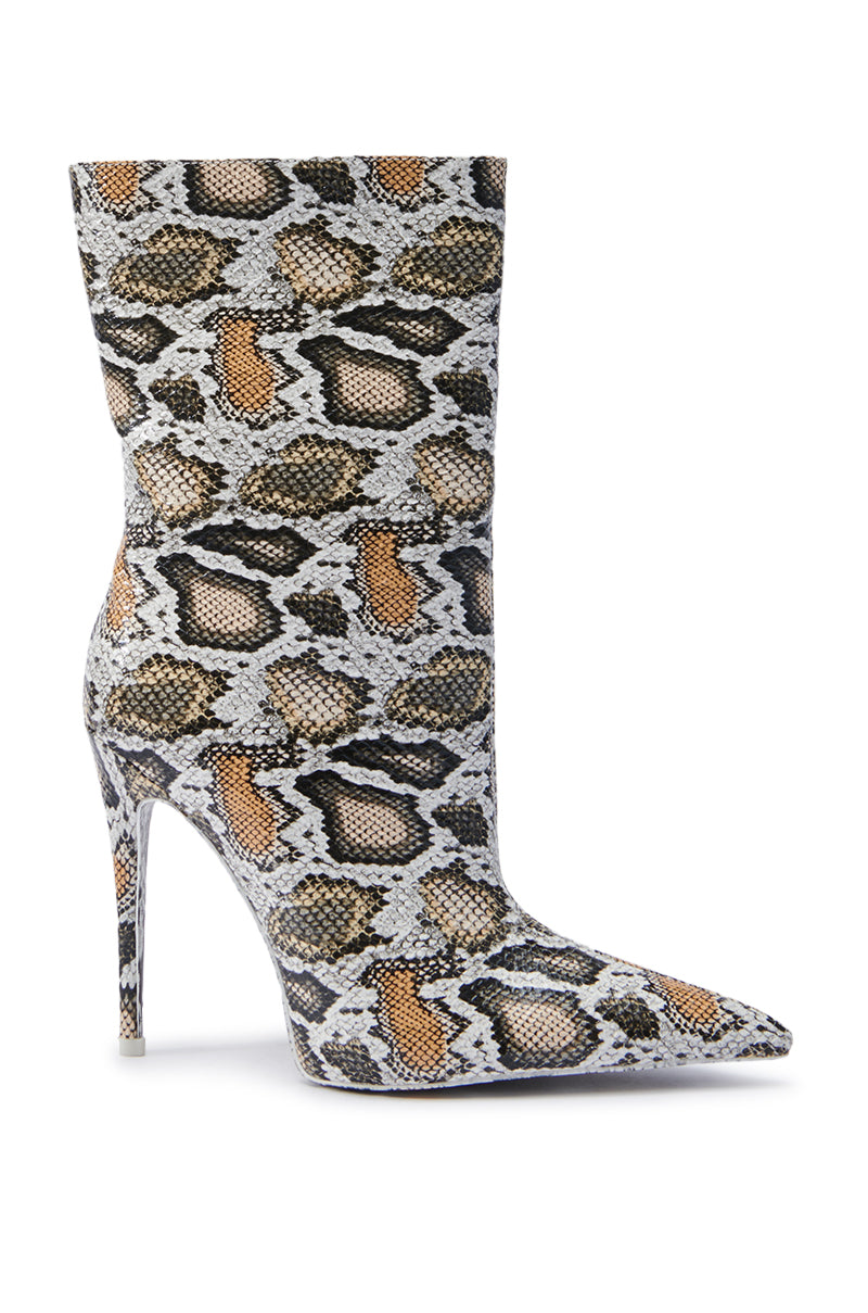 The AZALEA WANG SIBYLLE BEIGE SNAKE COCKTAIL BOOTIE boasts a striking leopard print in shades of brown, gray, and black with faux snakeskin details. Its pointed toe and slim stiletto heel ensure a chic and daring look, ideal for any trendsetting wardrobe.