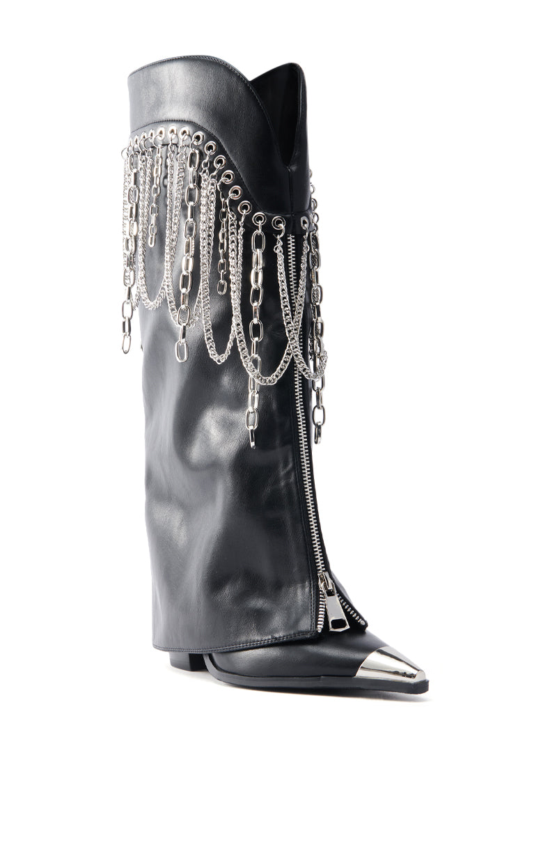 AZALEA WANG SINISTER BLACK WESTERN CHUNKY BOOT: Black faux leather knee-high with pointed toe, silver metal tip, metallic chains, zippers, and decorative fringe chains for a Western flair.