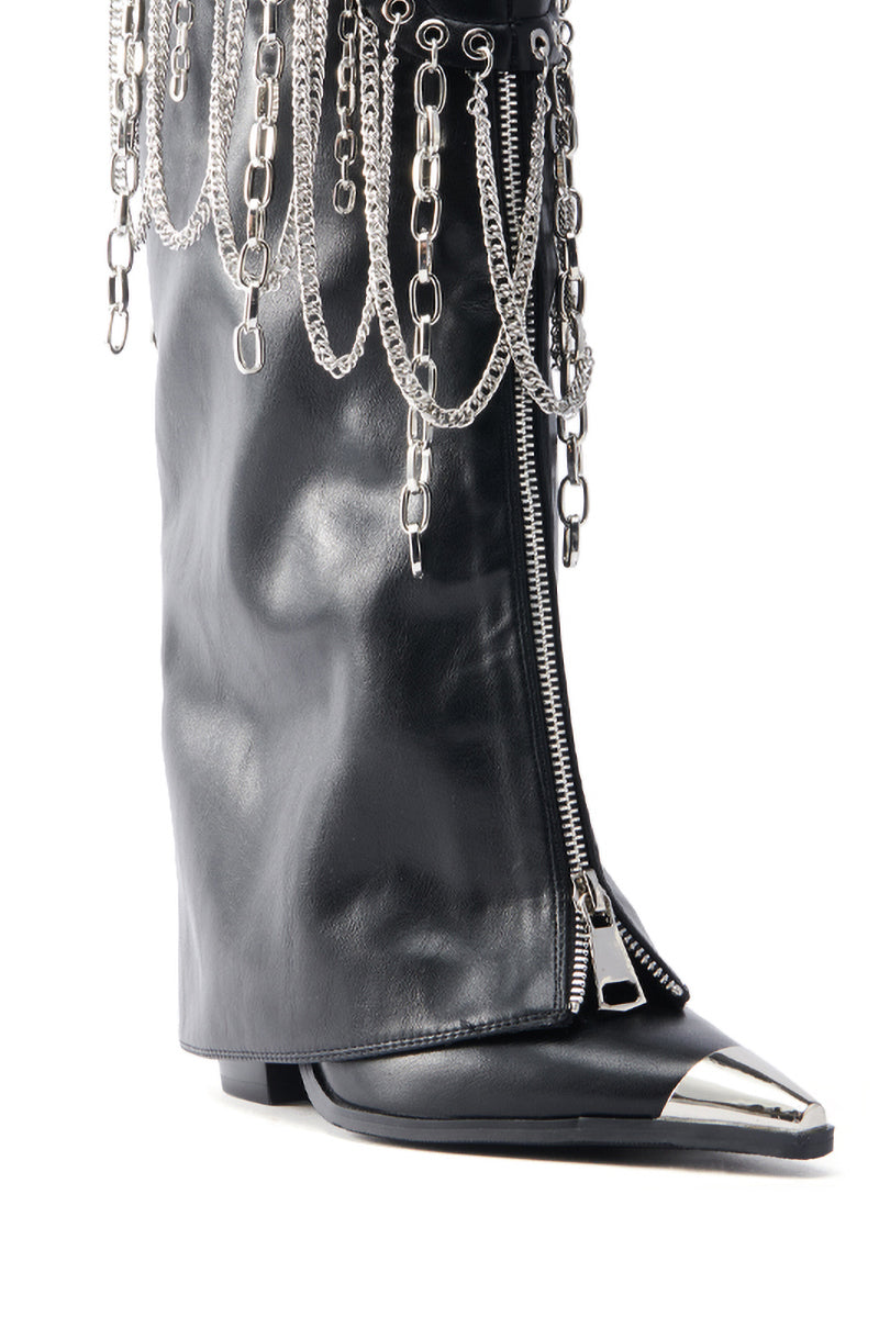 The AZALEA WANG SINISTER BLACK WESTERN CHUNKY BOOT features black faux leather with a silver pointed toe cap, metallic chains at the top, a prominent side zipper, and a stacked heel for an edgy and fashionable look.