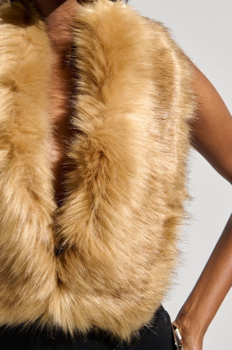 Close-up of a person wearing the FEELS GOOD BODYSUIT, featuring exquisite detailing. The texture is soft and fluffy, beautifully covering the upper body. Their arm is partially visible, standing against a neutral background.