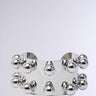 The WHAT A STUD SILVER CUFF is a wide, shiny faux silver bracelet featuring two rows of evenly spaced round beads—an effortlessly edgy accessory against a simple light gray background.