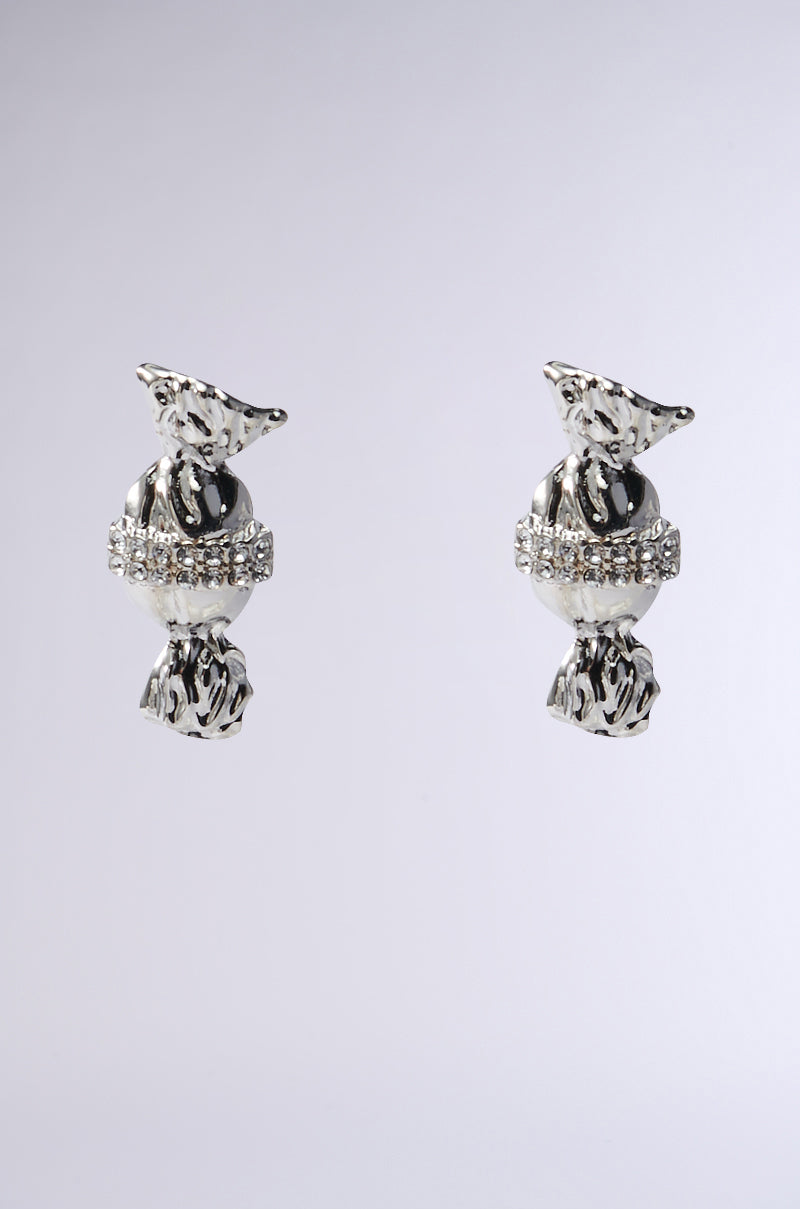 The TASTES SWEET EARRING offers faux silver, candy-shaped charm with rhinestone accents on a textured backdrop, promising a dazzling ear candy appeal.