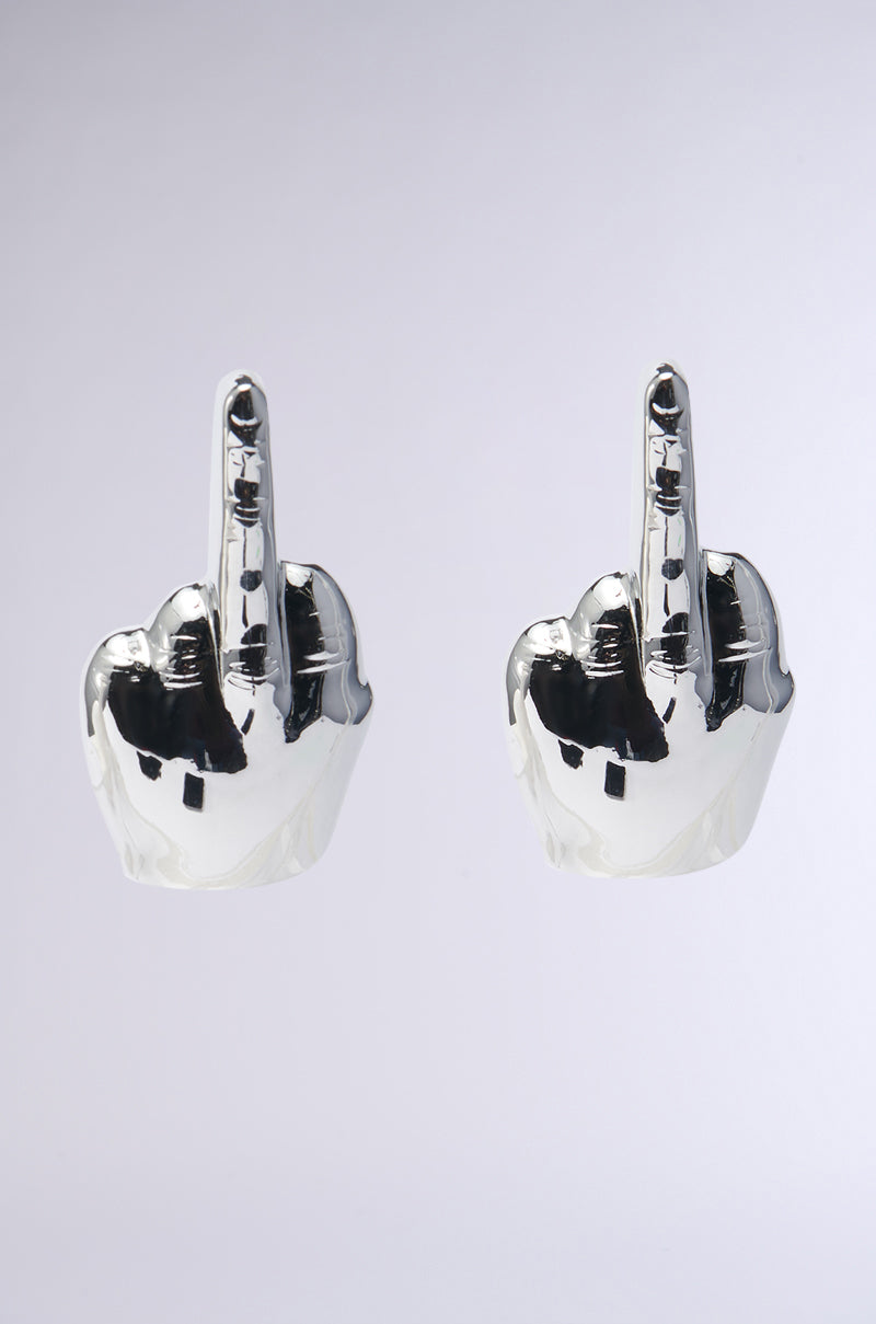 A pair of MY MOOD EARRINGS, designed as shiny metallic hands with middle fingers extended upwards, make a bold statement against a neutral background. 0