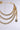 The BUY ME THIS NECKLACE features triple-layered thick faux gold Cuban chains with a small gold padlock charm, displayed against a plain light background.