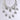 The IN MY CITY NECKLACE features sparkling "NY" rhinestone pendants on layered tiers, elegantly displayed against a plain light gray background.