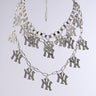 The IN MY CITY NECKLACE features sparkling "NY" rhinestone pendants on layered tiers, elegantly displayed against a plain light gray background.