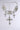 The FOREVER PROTECTED NECKLACE features a silver-tone filigree chain with three rhinestone cross pendants—one large center cross and two smaller side crosses. This sparkling statement piece secures with a chain closure.