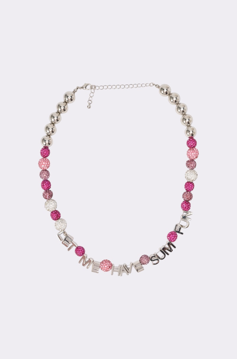 The WANNA HAVE FUN NECKLACE features alternating pink, silver, and glittery beads with metal letter charms that spell out "LET ME HAVE SUM FUN. 0