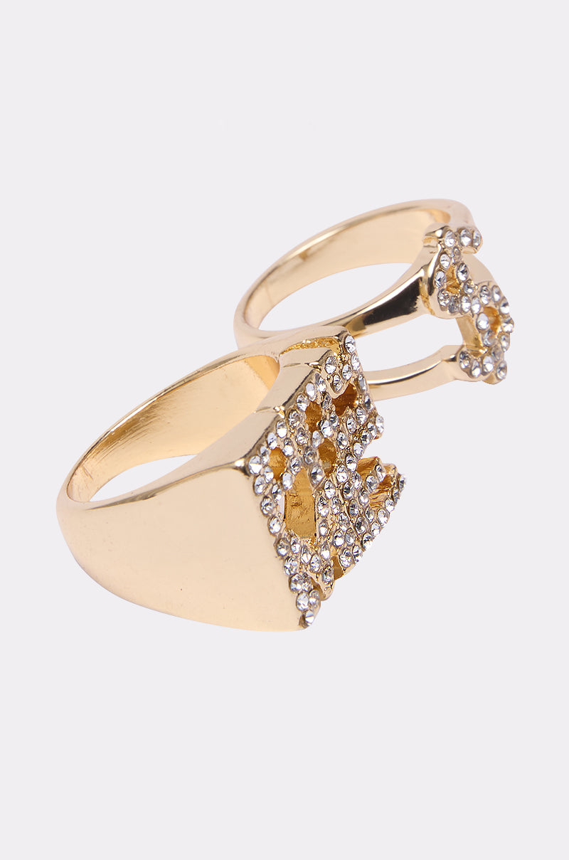 Two gold rings from the PAY ME RING SET feature square, crown-like designs with small, shiny white stones, shown on a plain white background.