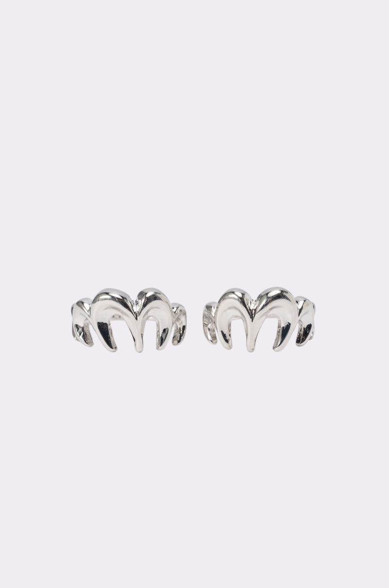 The BITE ME RING SET features two silver rings with a bold, curved design reminiscent of horns or waves—ideal for making a statement and adding distinctive flair to your accessories. Displayed side by side on a plain light gray background. 1