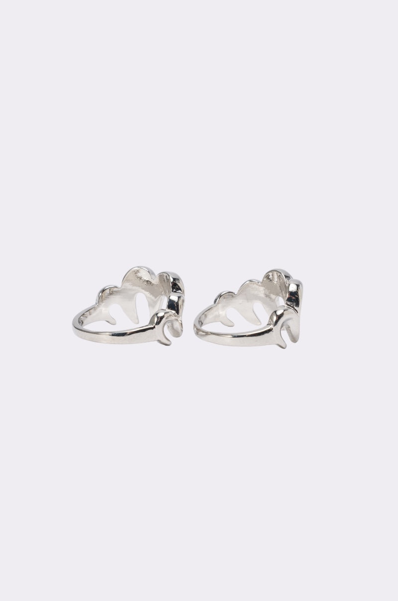 The BITE ME RING SET pairs perfectly with silver leaf-shaped earrings featuring cutout details, showcased on a plain light background—ideal for bold statement looks. 2