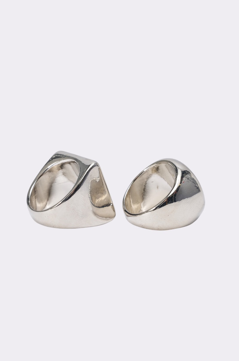 The IM THE INSPO RING SET features two chunky, smooth, geometric silver-tone rings shown side by side on a plain background—a modern statement jewelry look. 2