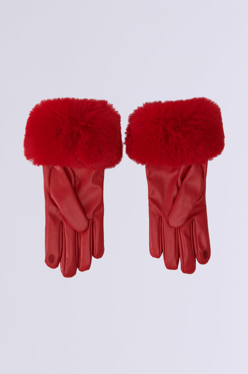 The ALL I WANT IS MONEY FUR GLOVES are red faux leather gloves with fluffy faux fur cuffs, ideal for touchscreen use, showcased against a plain light background. 5