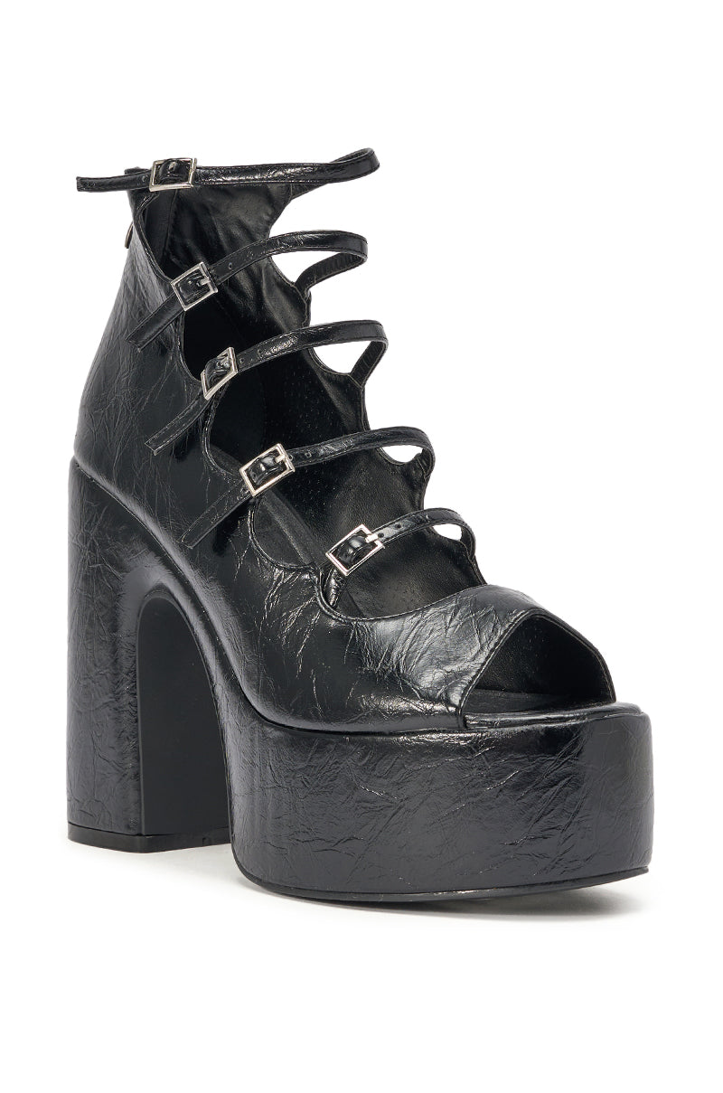 The AZALEA WANG SMITTEN BLACK PU STRAPPY BLOCK HEEL SANDAL features shiny black faux leather, a chunky block heel, open toe, and five crisscrossing buckle straps for a chic caged look with standout textured style. 5