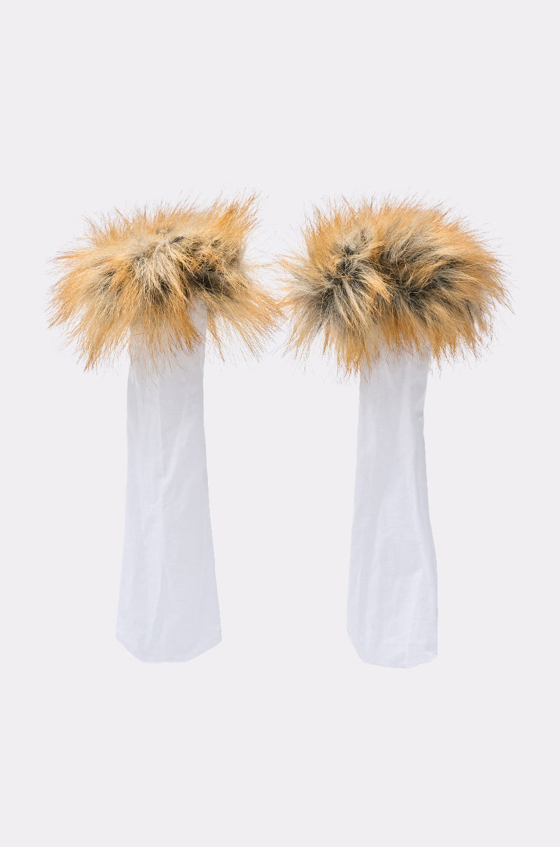 The REALLY LIKE THAT FUR TRIM SOCKS feature two white fabric sleeves with large, fluffy brown and black faux fur trim at the top, shown standing upright against a plain white background. 1