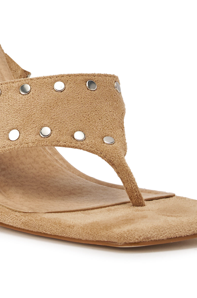 Close-up of the AZALEA WANG SODALITE NUDE FAUX SUEDE LACE UP SANDAL with metallic studs on the wide strap, a textured footbed, and a square toe design. 7