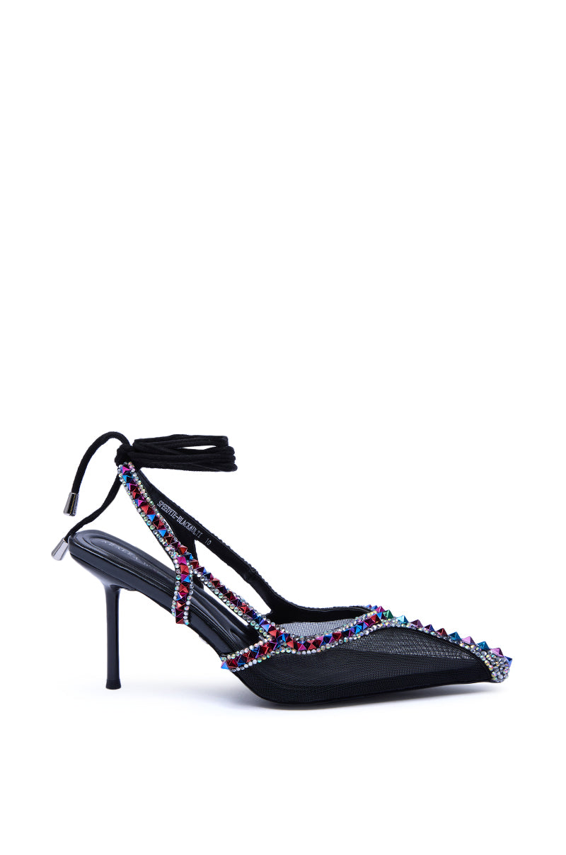 The AZALEA WANG SPEEDYIE Black Multi Mesh Pump features a pointed toe, mesh upper, multicolored rhinestone beaded straps wrapping the foot and ankle, and a back tie closure—a bold twist on the classic black stiletto.