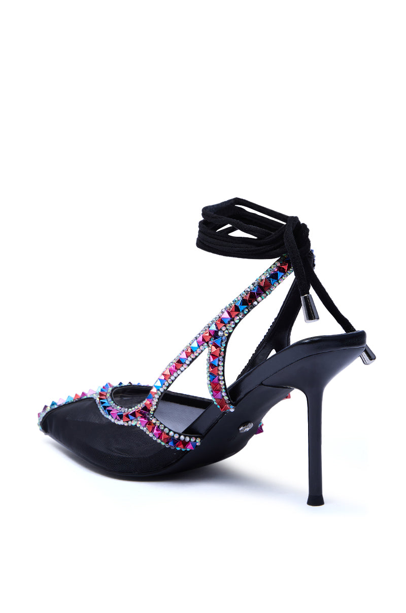 The AZALEA WANG SPEEDYIE Black Multi Mesh Pump features a pointed toe, strappy stiletto heel, ankle lace-up tie, and is adorned with multi-colored rhinestones, shown against a white background.