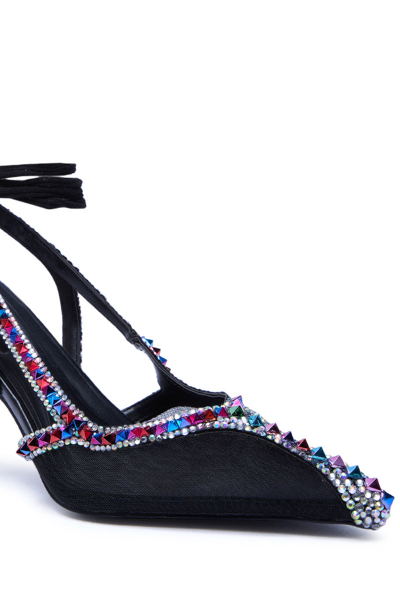The AZALEA WANG SPEEDYIE black mesh pump features a pointed toe, black ankle straps, and is embellished with multi-colored rhinestones and studs along the edge.
