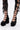 Person wearing black lace-up leggings and AZALEA WANG SPREENE FRILL LACE PUMP IN BLACK, featuring layered ruffle details and multiple straps, standing on a white background.