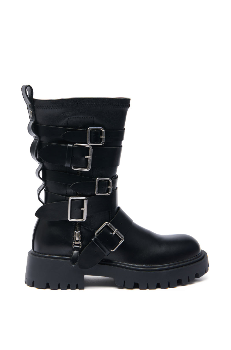 The AZALEA WANG SPRIDY BLACK BELTED COMBAT BOOTIE is a black mid-calf boot with a chunky lug sole, silver buckles, front and side straps, plus back lace-up detailing for added edge.