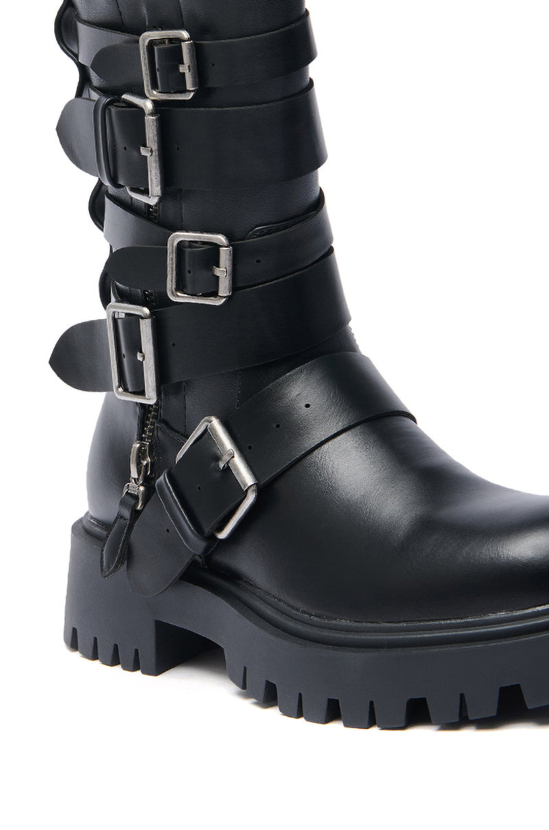 The AZALEA WANG SPRIDY BLACK BELTED COMBAT BOOTIE is a black faux leather mid-calf boot with multiple silver buckles, horizontal straps, a thick lug sole, and a convenient side zipper.