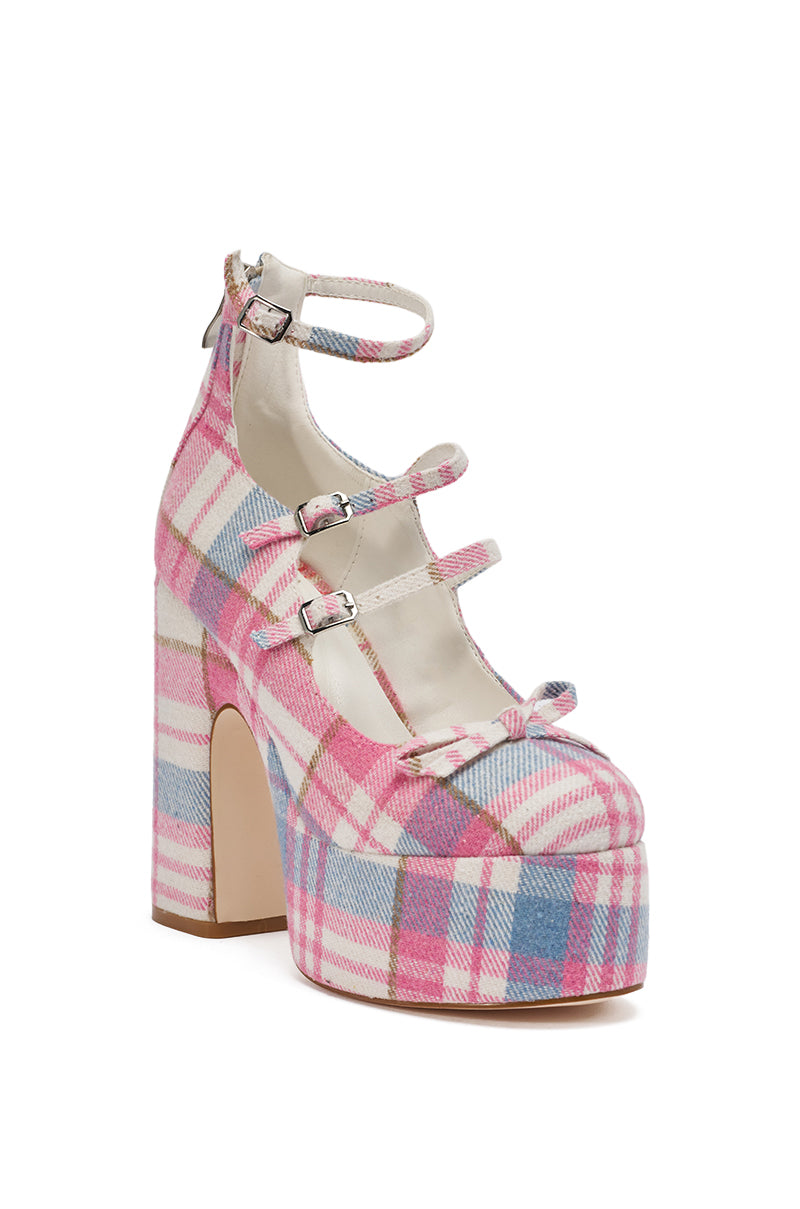 The AZALEA WANG SPROUT Pink Plaid Chunky Pump features a high heel, pink, white, and blue plaid design, three thin buckle straps across the front, a chunky platform heel, and a small bow by the toe. 5