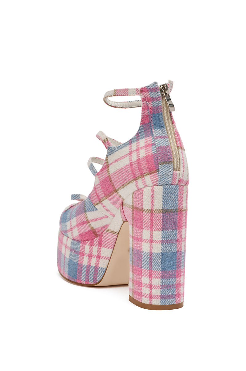 The AZALEA WANG SPROUT Pink Plaid Chunky Pump features a platform heel, bold chunky silhouette, pink plaid fabric, three side buckled straps, back zipper closure, and a comfort cushion insole for all-day style and support. 6
