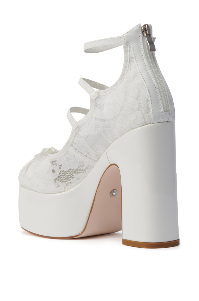 The AZALEA WANG SPROUT WHITE PUMP is a white high-heeled platform shoe featuring a chunky heel, almond toe, delicate lace overlay, multiple straps, and a back zipper. Its light tan sole enhances the elegant, feminine look. 5