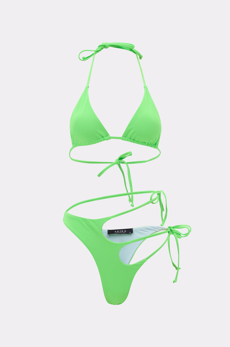 The CUT IT OUT SWIM SUIT is a neon green bikini with a triangle top and high-cut, adjustable tie bottoms, made from stretch swim fabric. Shown against a plain light gray background.
