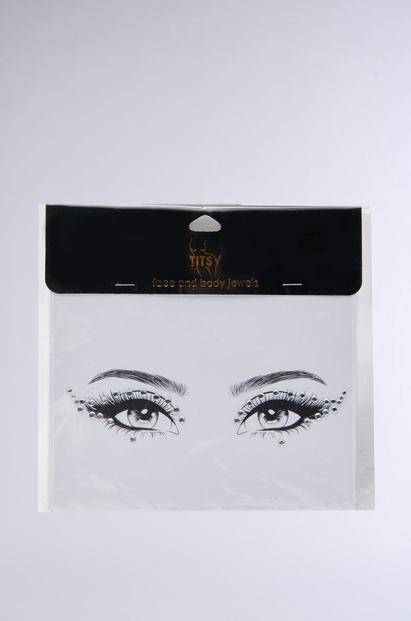 The WING IT OUT EYE GEMS package, ideal for festivals, showcases stylized eyes adorned with sparkling face and body jewels against a plain background.